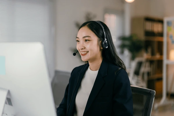 smiling-businesswoman-works-her-desk-600nw-2535492847